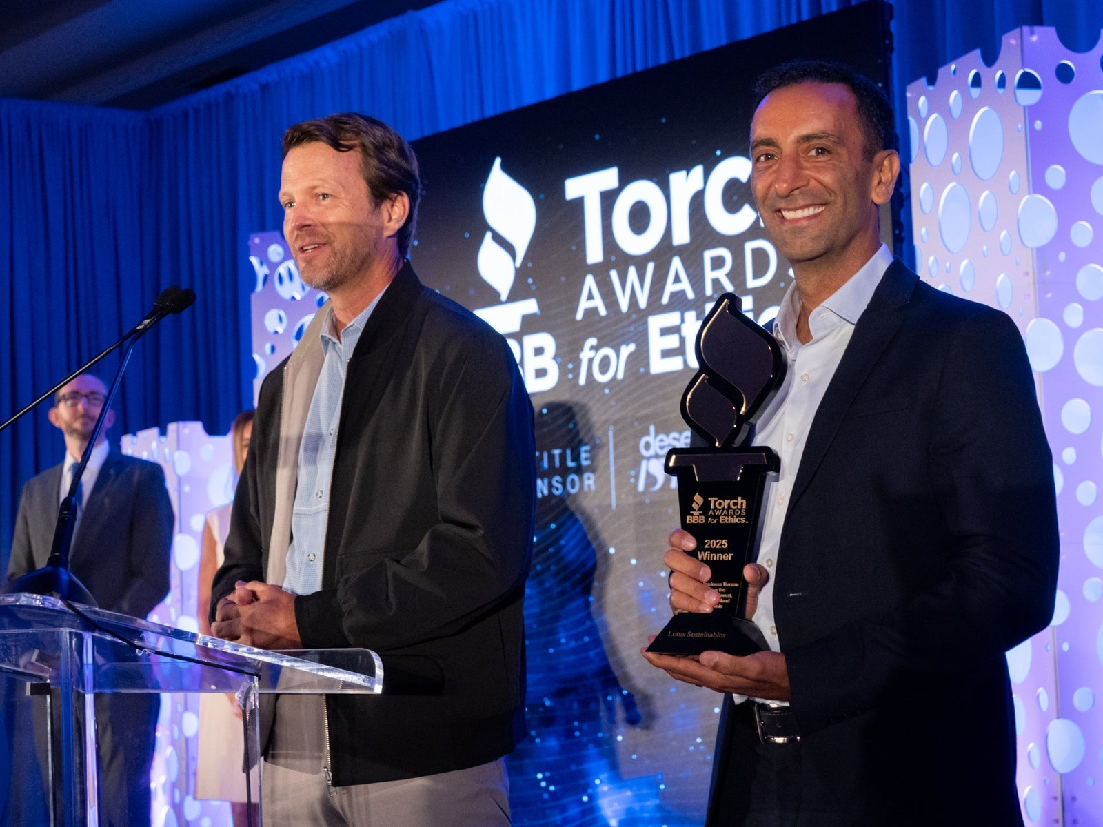 Jesse (CEO) and Farzan (Co-Founder) accepting 2025 San Diego BBB Torch Awards for Ethics Winner award.